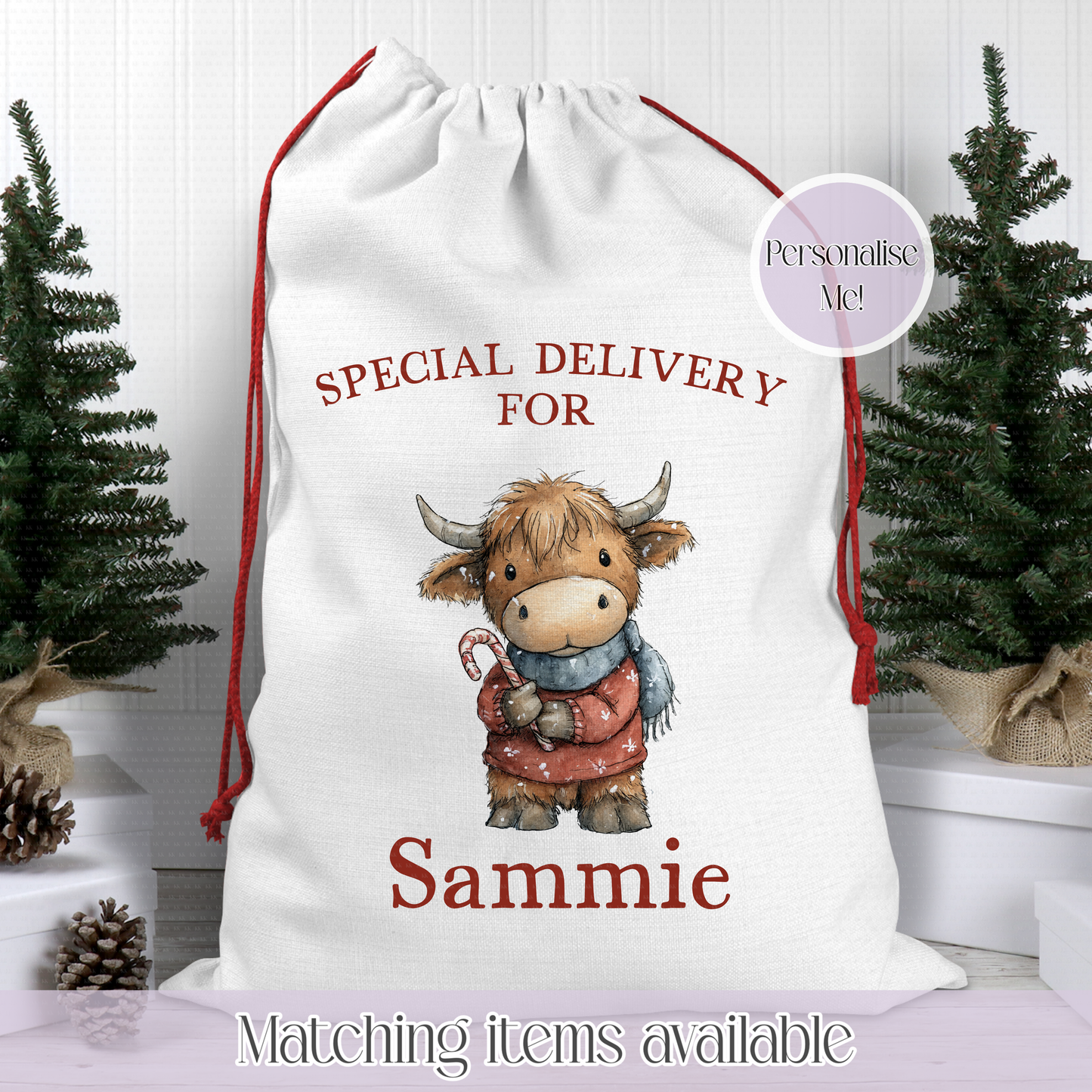 Personalized Christmas sack with a cartoon cow holding a candy cane, sitting on a white surface with Christmas trees in the background.